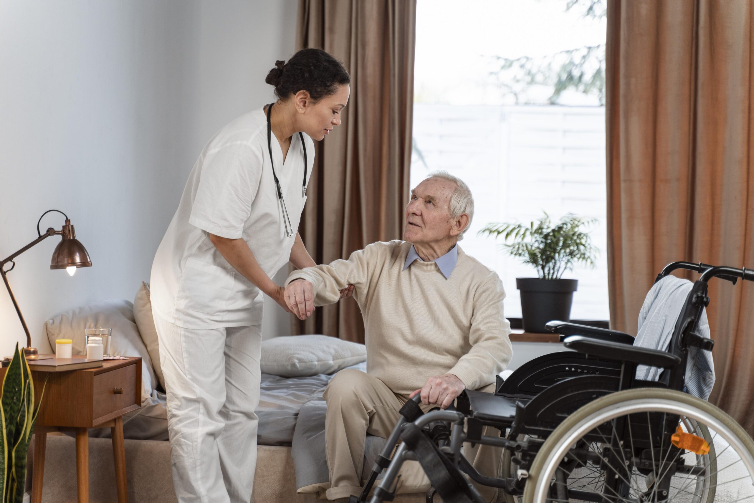 doctor helping senior patient scaled