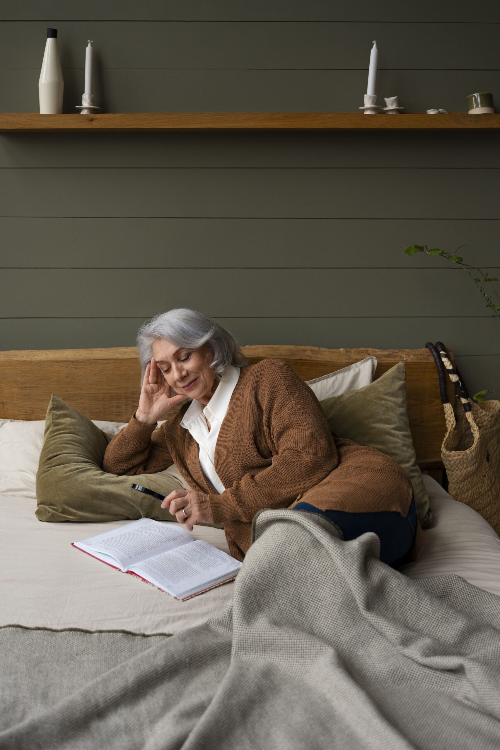 Woman laying on top of bed